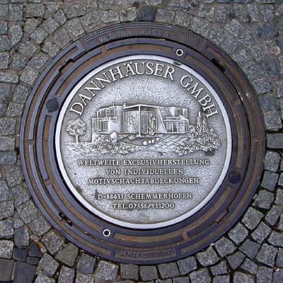 Dannhäuser GmbH Ad on Manhole Cover